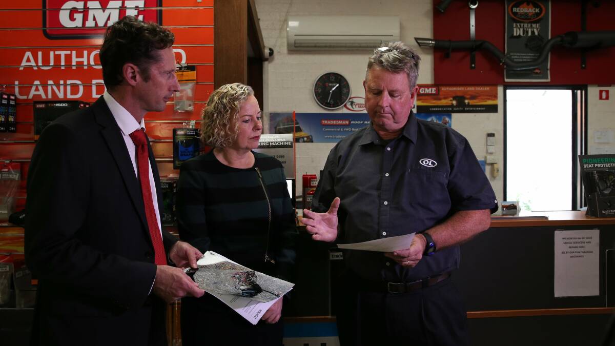 BAD CONNECTION: Gordon Allerton of Islington auto business Opposite Lock, at right, speaking with Labor's regional communications spokesperson Stephen Jones and Newcastle MP Sharon Claydon on June 1 this year, talking about telecommunications problems at his business. Picture: Simone De Peak.