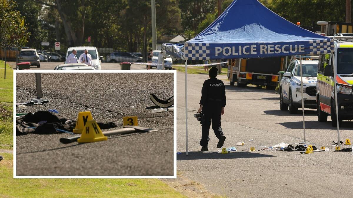 Police comb the scene where a man died in Raymond Terrace. Pictures by Marina Neil