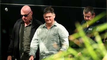 Graham McBride, who lost his wife and daughter Nadene and Kyah, and Matt Mullen, who lost his daughter Bec Mullen, leave Newcastle court on May 8. Picture by Peter Lorimer