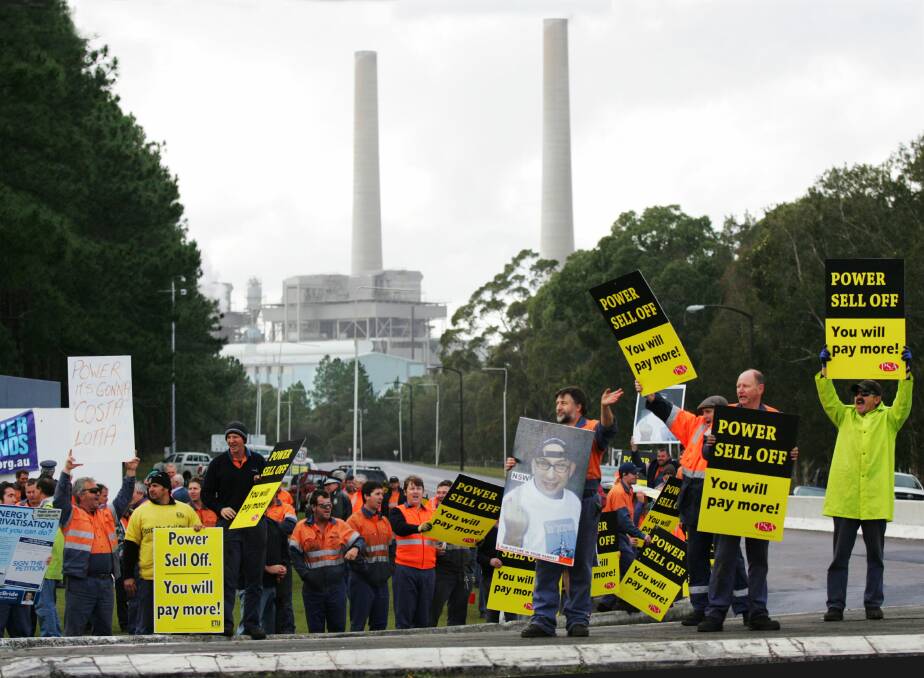 ON WAY OUT: Power privatisation protesters rally outside Munmorah Power Station in 2008. Work will start in July to demolish the power station. Picture: Aaron Brown