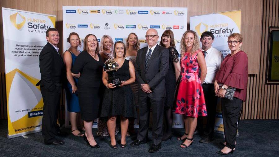 SAFETY FIRST: Anglican Care staff with their award. Picture: Supplied.