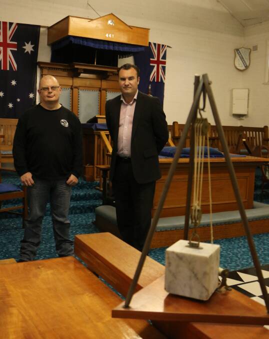 TRADITIONS: Freemasons Garth Weiley, right, and John Treuren, inside the Morisset Lodge which will host an open day on Saturday, November 5. Picture: David Stewart