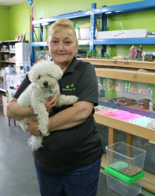 FURRY FAREWELL: Cherylynn Mellor of Catalina Pets, with Toby, the store mascot, shortly before the store's closure last Saturday. Picture: David Stewart