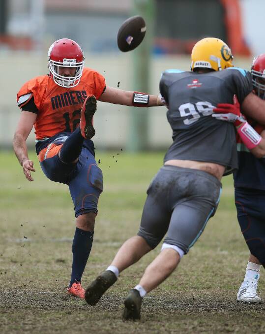 DOWN TOWN: Action from the Hunter Gridiron League's grand final at Speers Point on Sunday. The National Gridiron League is coming to the Central Coast later this year. Picture: Marina Neil