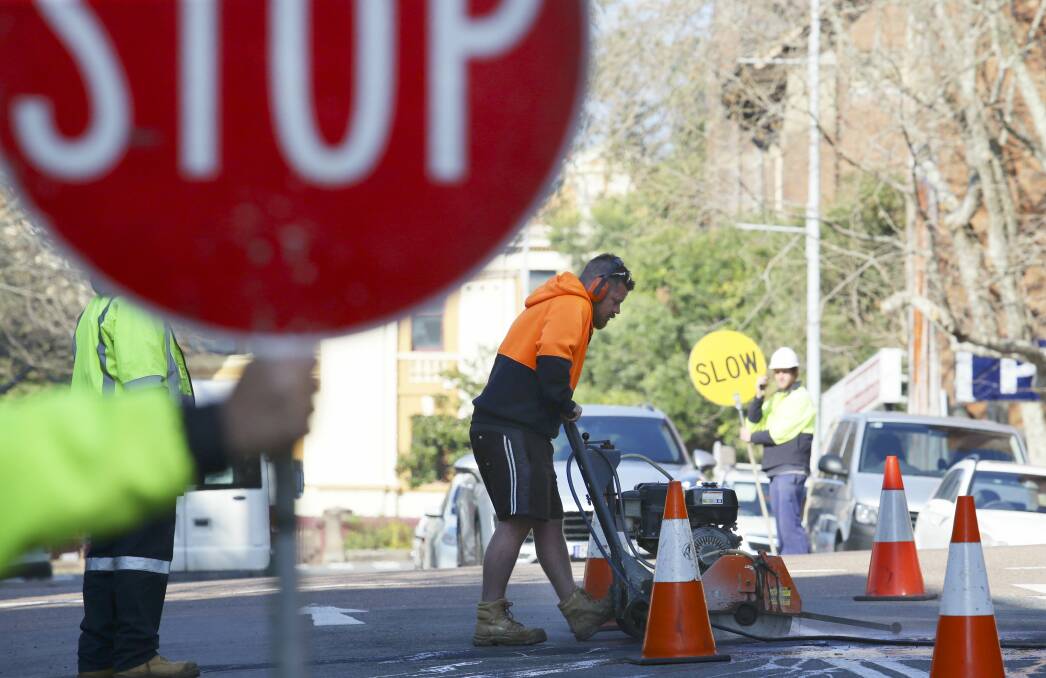 TAKE CARE: Road works continue this week on Freemans Drive, Freemans Waterhole. Picture: Peter Stoop