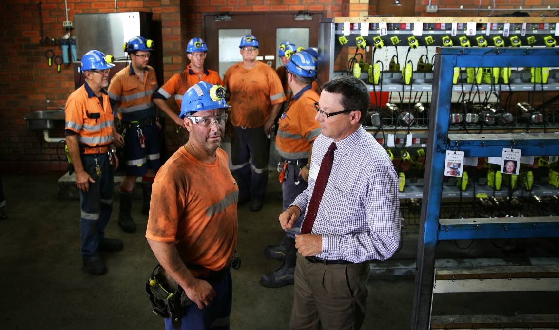 ECONOMIC DRIVER: Behind the scenes at Centennial Coal's Myuna colliery, in Wangi Wangi. Miner Steve Callen talks with Parliamentary Secretary for the Hunter and Central Coast, Scot MacDonald. Picture: Marina Neil