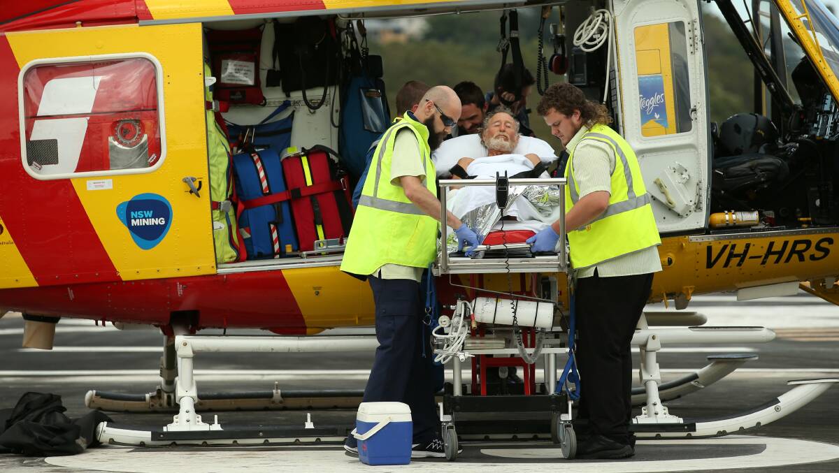 SURVIVOR: Shark attack victim Colin Rolin, 62, is wheeled into the Westpac Rescue Helicopter to be airlifted to John Hunter Hospital after his encounter with what has been estimated as a four-metre long shark near Forster last week. He is the eighth person to be attacked by a shark in NSW in 2016. Picture: Max Mason-Hubers