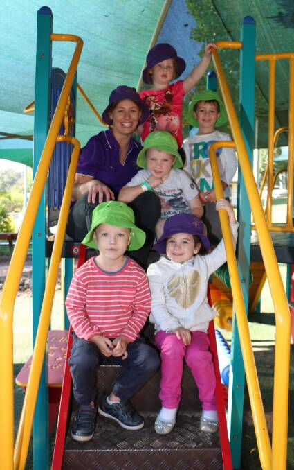 HANDS ON: Jessica Watt with children at Peter Pan Preschool, Wangi Wangi, this week. Her job was a source of immense satisfaction, she said. Picture: David Stewart