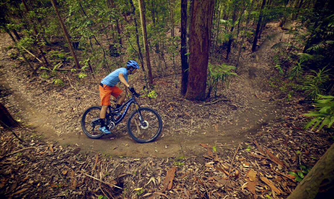 IN THE FLOW: A rider negotiates a bend in Awaba Mountain Bike Park. The trail is set to be a highlight of this year's Port to Port MTB stage at Cooranbong this Saturday. Picture: Supplied