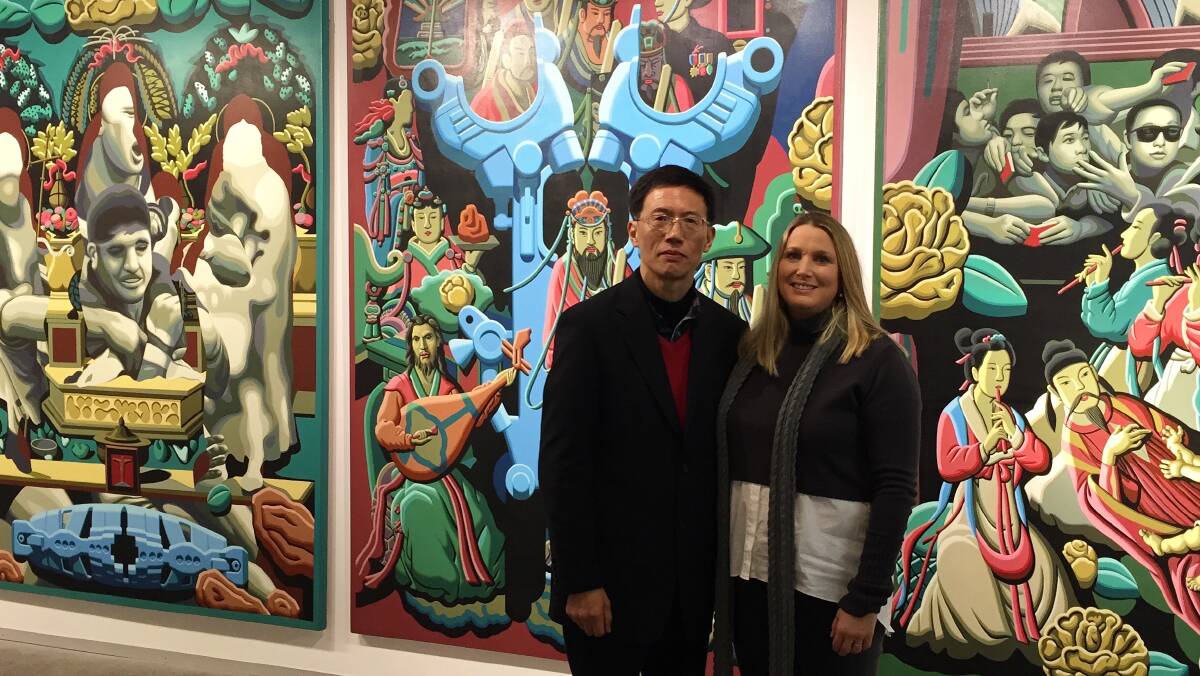 NEW JUDGE: Laura Wilson with artist Fan Donwang at the opening of his exhibition at the University of Newcastle Gallery. Picture: Supplied