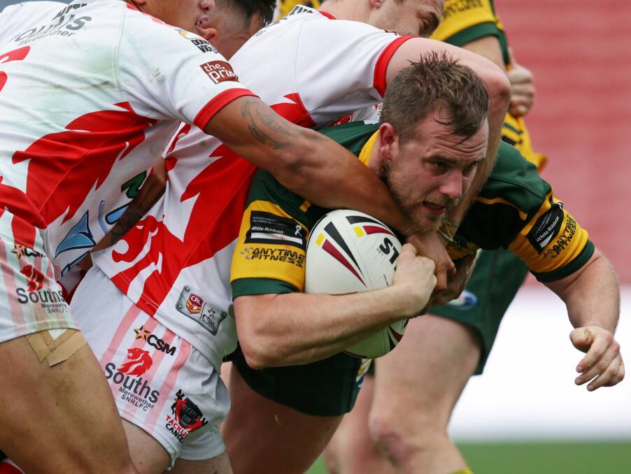 TIGHT GRIP: Macquarie hooker Chris Hyde was the focus of plenty of rugged defensive attention from the Souths forwards. Picture: Jonathan Carroll