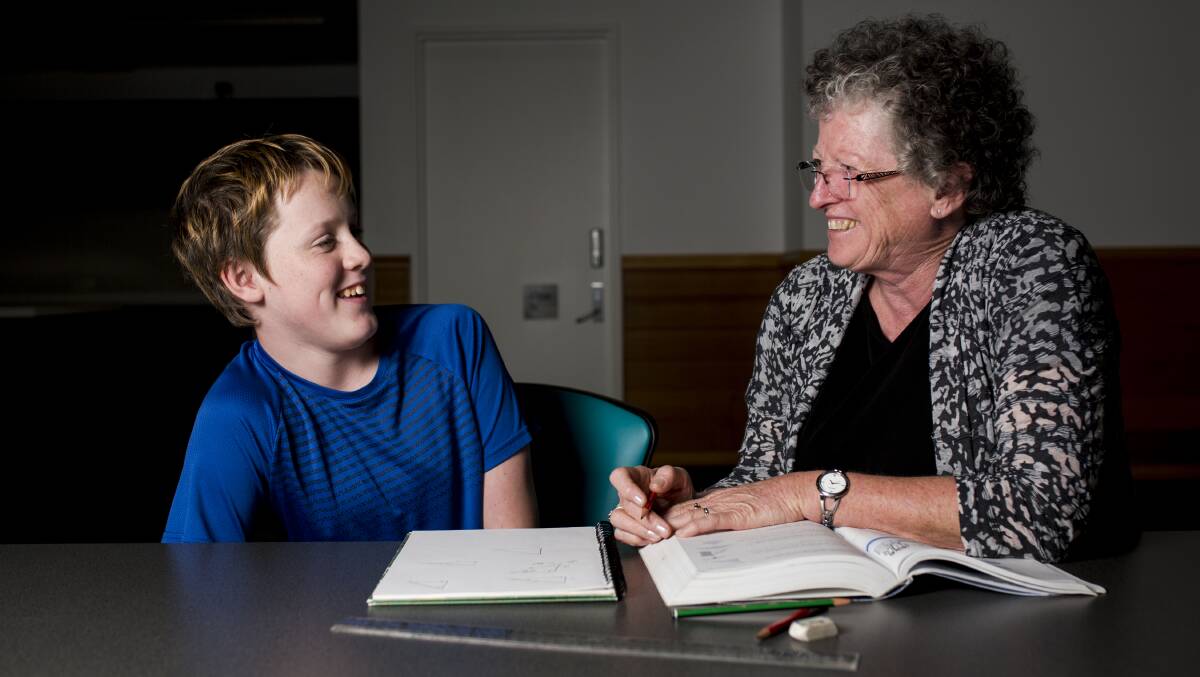 OUTCOMES: Student Malakai Reinhard 14, and Smith Family Learning Club volunteer Ann. Picture: Jamila Toderas