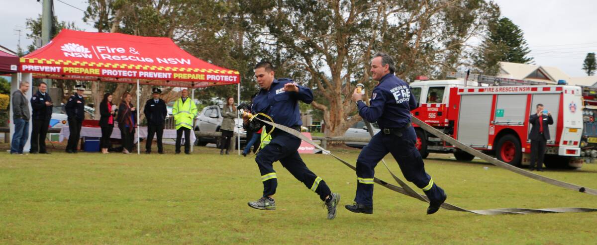 HOSE RUN: NSW Fire and Rescue Wyong brigade firefighters Tim Rivera, left, and Rick Cole in training for the State Firefighter Championships to be held at Norah Head this week. Picture: David Stewart