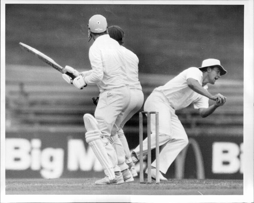 GOT HIM: Mark Taylor takes a catch at slip to dismiss Vic Marks off the bowling of Robert Holland in a Sheffield Shield match at Sydney in 1986. Picture: Fairfax Media