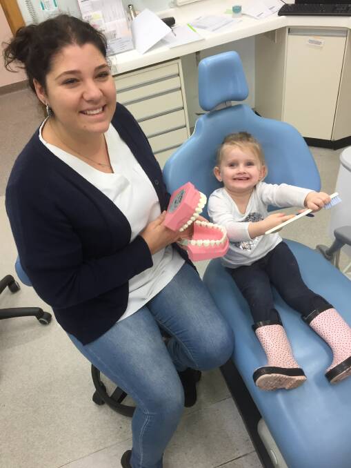 NEW ADVICE: Ayla, 3, and dental assistant Taleah Donaldson at Wyong Dental Health Clinic. Picture: Supplied