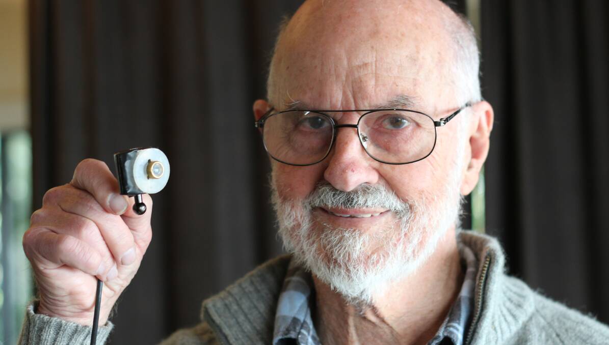 EYE SEE: Barry Gow with his Wangiscope, developed over seven years in his home workshop at Wangi Wangi. Picture: David Stewart