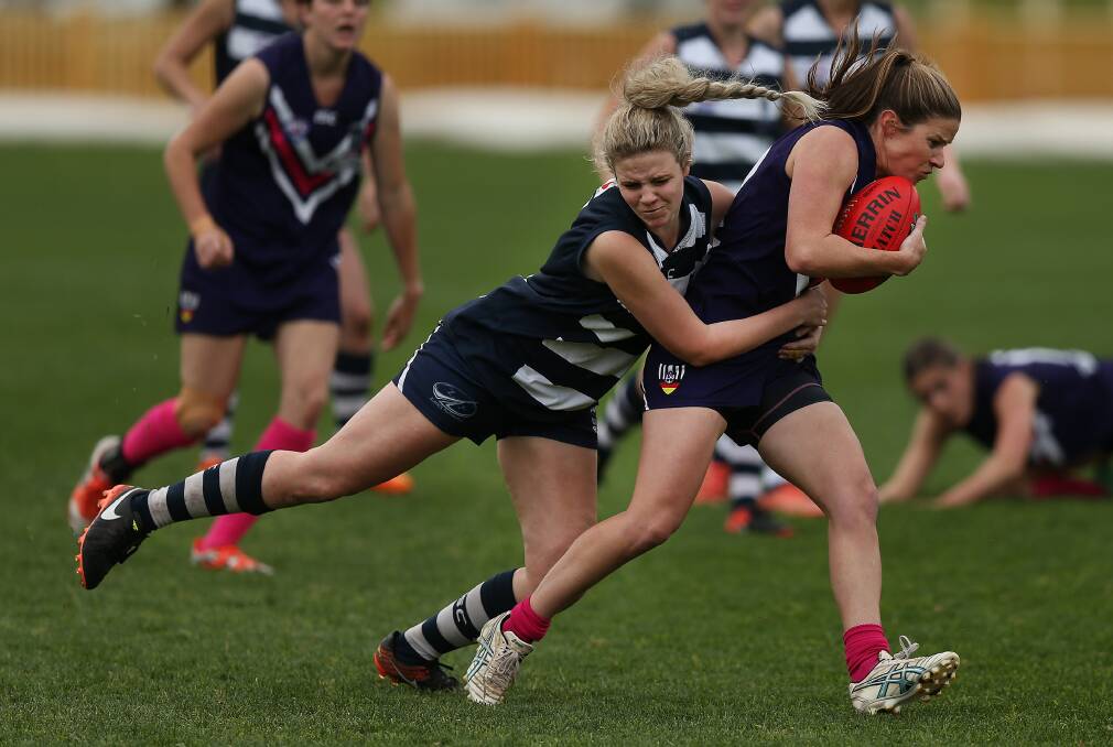 GRASSROOTS: Action from the Lake Macquarie versus Muswellbrook women's Black Diamond Australian football match this year. The state government is offering local sports clubs funding to encourage more talented girls and young women into sport. Picture: Marina Neil