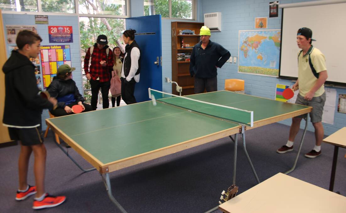 CASUAL: The boys enjoy playing table-tennis, right in the centre of the unconventional classroom. Picture: David Stewart