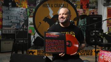 Hiss and Crackle owner Mitchel Eaton makes his final preparations ahead of Record Store Day on Saturday, April 20. The annual one-day sale event has become a pilgrimage for music's faithful, on the hunt for a bargain, a rare find, or that one elusive LP. Picture by Simone De Peak 