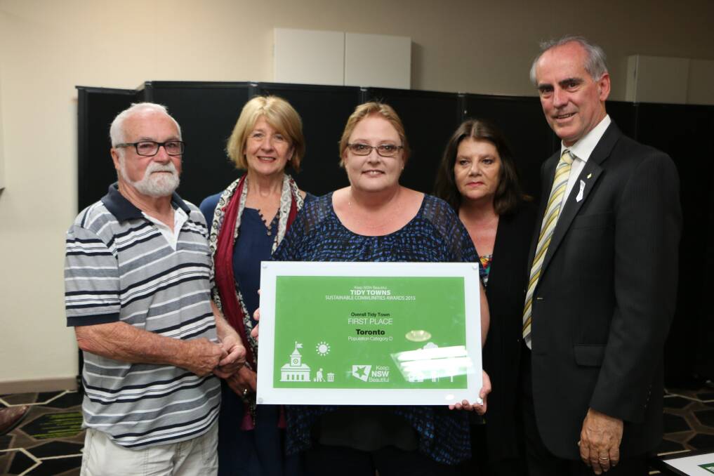 WELL DONE: Toronto Tidy Towns committee, from left, treasurer Henry Wellsmore, vice-president Wendy Harrison, president Kelly Hoare, and secretary Lyn Pascoe, with Member for Lake Macquarie, Greg Piper, at Monday's presentation. Picture: David Stewart
