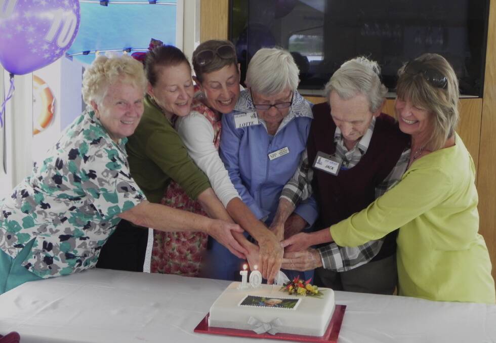 MILESTONE: Pictured at the cake cutting are, from left, Marilyn Dickson, Marie Martin, Sandra Kirby, Lotte Bluhm, Jack Wiltshire and Pam Cammareri.