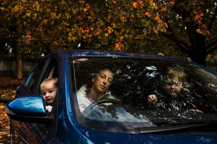 SMH/NEWS.  Portrait of Lauren Wotton and her children who is an AAMi customer and has been screwed by them in a claim.  Photographed with her children in the car at Clontaft Reserve SANDY BAY RD.   PIC BY NIC WALKER.  DATE 15TH MAY 2017.