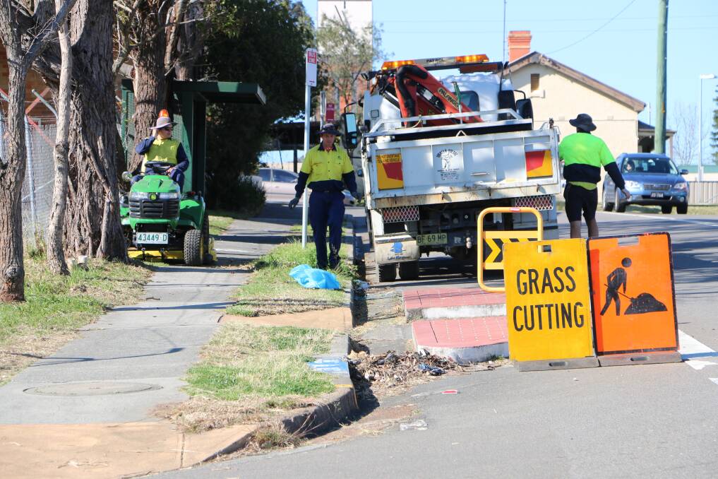 BUSY CORNER: Council's CiviLake staff tend to the Morisset site last week. Picture: David Stewart