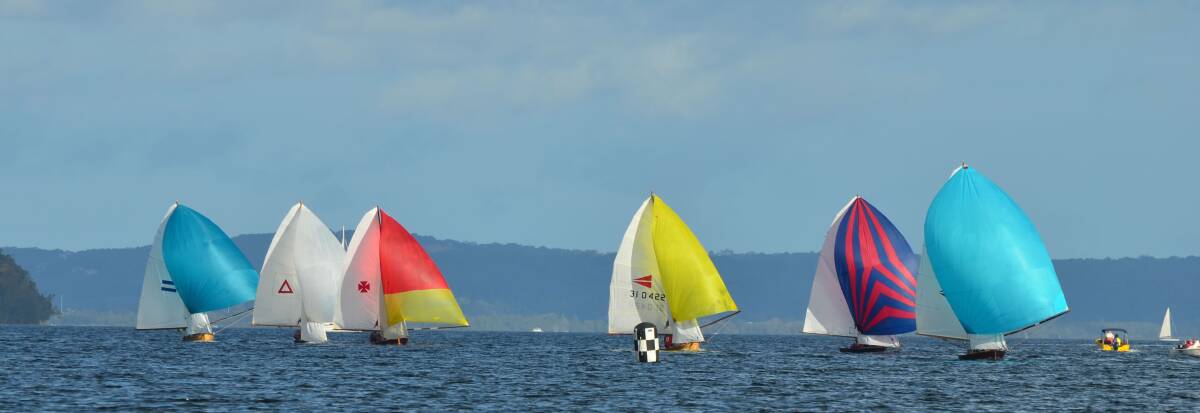 CLOSE CONTEST: The racing at Teralba was tight and exciting for the Historic 10 ft Skiff Australian Championship Regatta on Sunday.