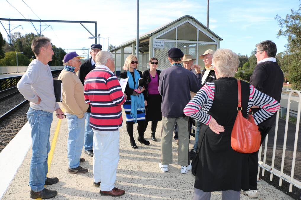 FRUSTRATIONS RAISED: Residents talk to RMS regional manager Anna Zycki (with blue scarf) at Dora Creek on Monday. Picture: Jamieson Murphy