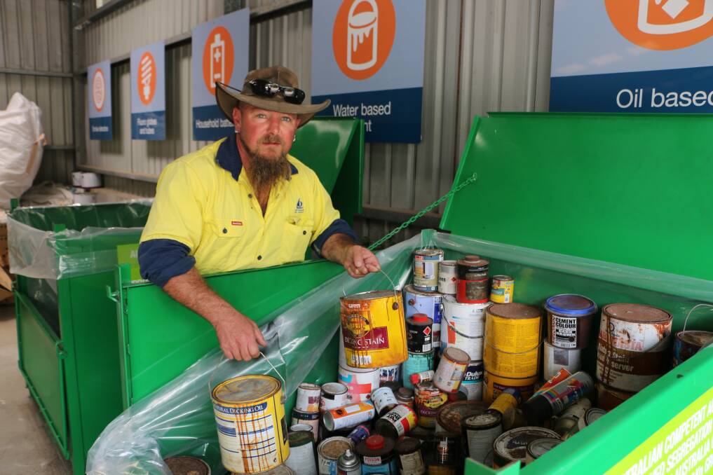 FREE DISPOSAL: Leading hand Tim Prisk with the latest batch of paints left for processing at the CRC at Awaba this week. Picture: David Stewart