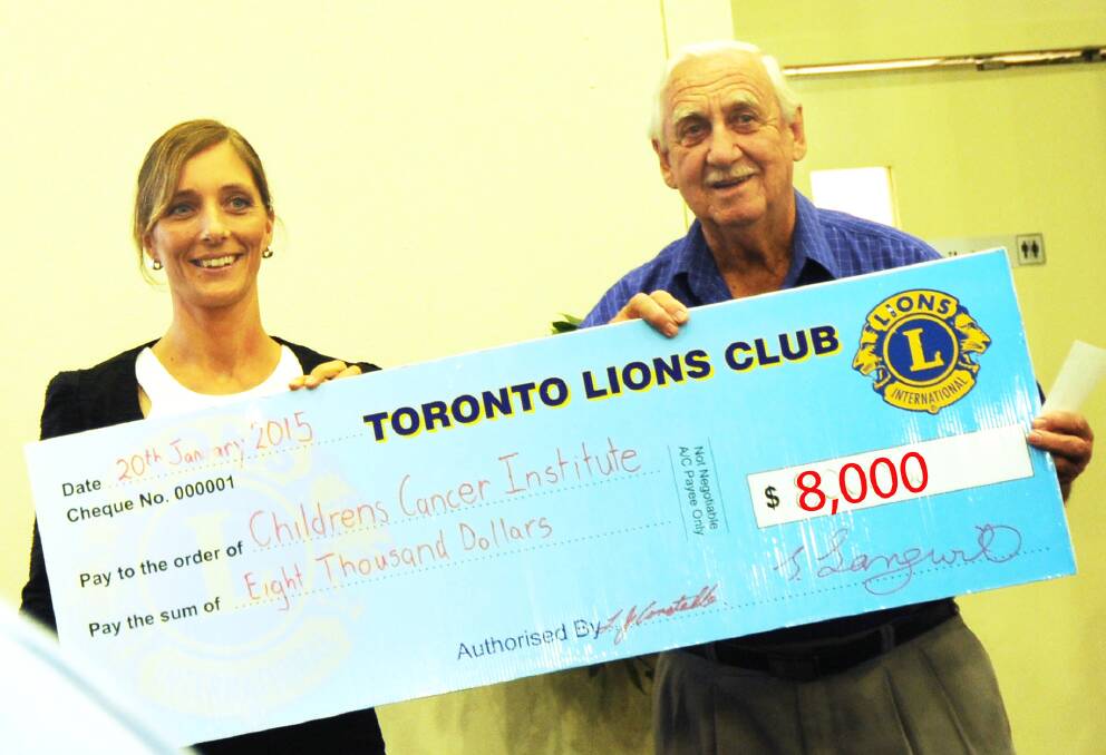 BIG BUCKS: Rebekka Williams from the Children's Cancer Institute, with Lion Ross Richley.