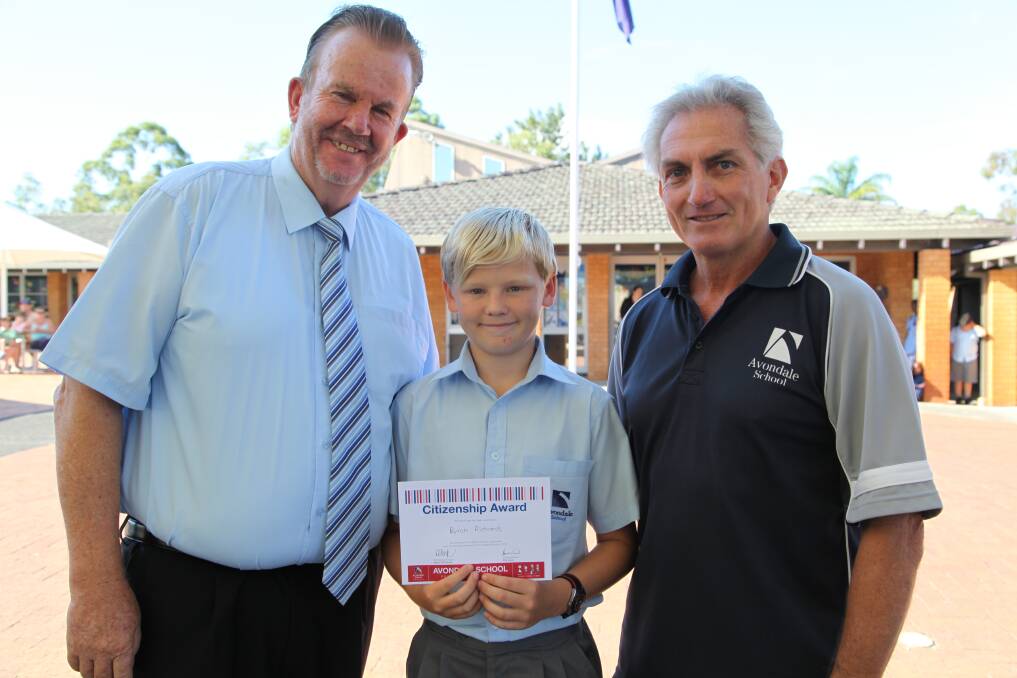 AWARDED: Student Byron Richards with principal Dr David Faull, left, and primary sports co-ordinator Graham Head. Picture: Terrina Mesaric