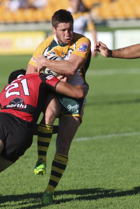 LEADER: Wyong's Mitch Williams tries to power his way through the North Sydney defence. Picture: David Stewart