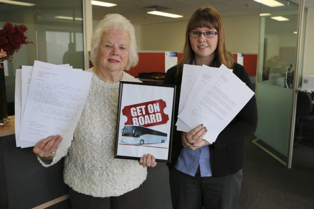 SUPPORT: Noleen Robinson, left, collects the latest batch of letters from the Lakes Mail’s Hayley Thurtell. The Lakes Mail is one of several local businesses where locals can leave their letters backing the bus campaign. Picture: David Stewart