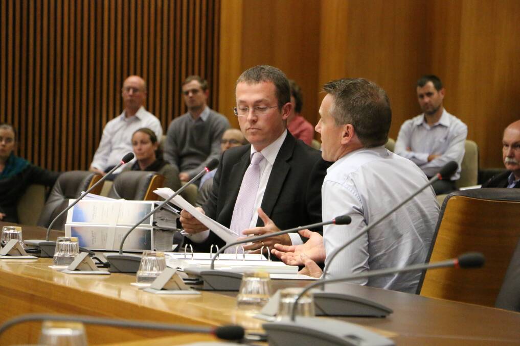ANSWERS: JPG development director, Bryan Garland, left, and marina consultant Les Binkin speak at the Joint Regional Planning Panel meeting at Lake Macquarie City Council Chambers. Picture: Jamieson Murphy