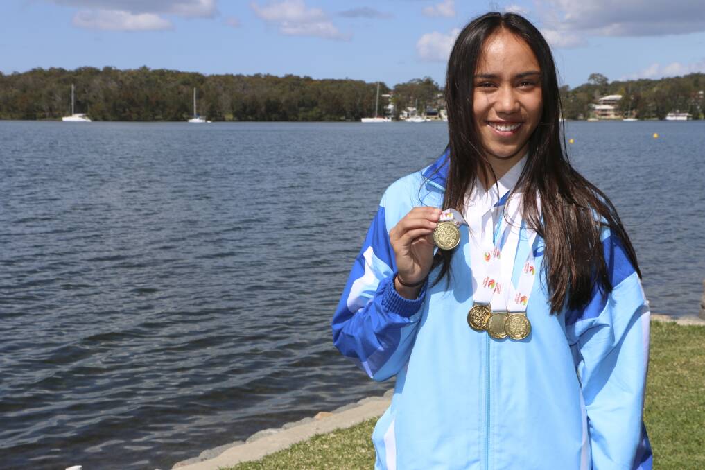 HEAVY METAL: Dakota Thomas with the four goal medals she won at the Australian Junior Athletics Championships. Picture: Jamieson Murphy