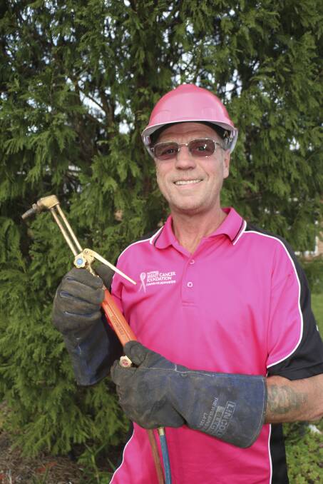 PRETTY IN PINK: Rob Newell encourages everyone from office workers to tradies to raise money for breast cancer by wearing pink to work. Picture: Jamieson Murphy
