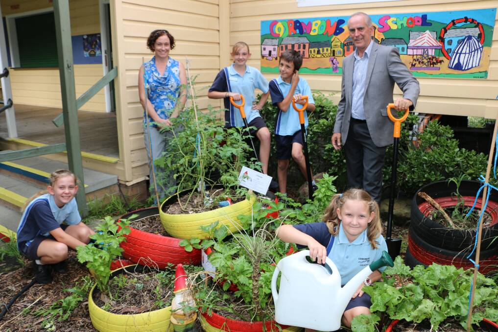 INITIATIVE: Cooranbong Public School students Tahlia and Imogen Ward, Chloe Rose and Joel Kamarilli with teacher Vanessa Miller and MP Greg Piper. Picture: Jamieson Murphy