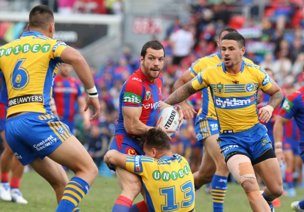 FRUSTRATING: Jarrod Mullen looks for support as the Eels' defence closes in at Hunter Stadium.