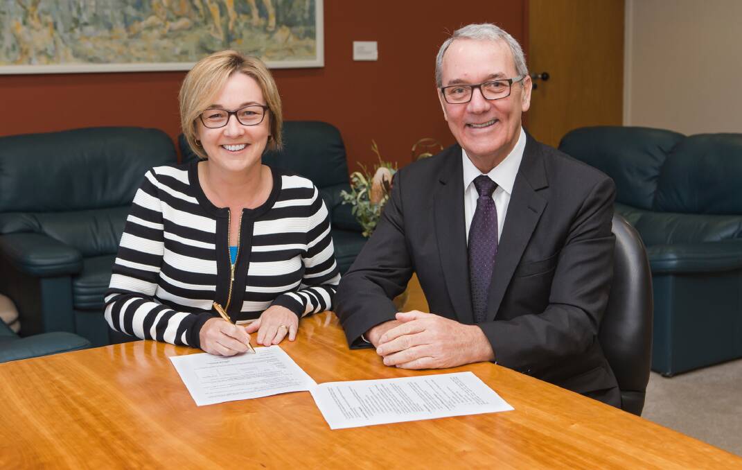 MORE OPPORTUNITY: Mayor Jodie Harrison and council's general manager Brian Bell signing the charter.