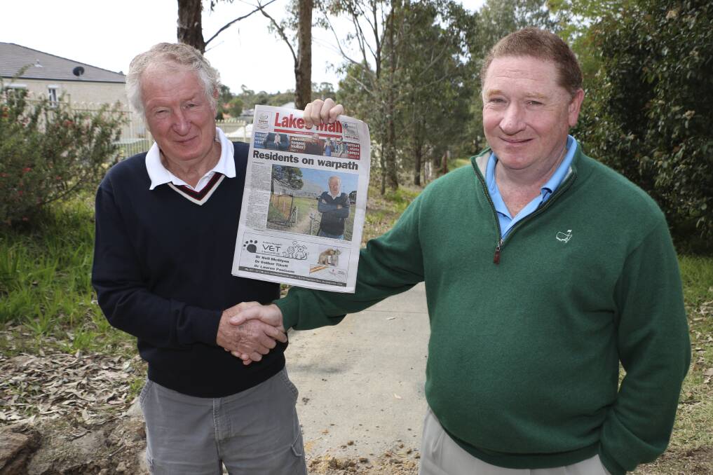 WIN WIN: Phillip Bleese, left, and Peter Cullen pictured at the Bonnells Bay path on Monday. The pair are celebrating the fruition of a commonsense solution featured in the Lakes Mail's recent front page story, and delivered in quick time by authorities. Picture: Jamieson Murphy