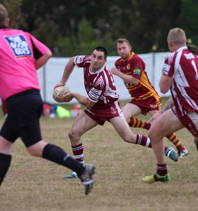 WIDE OPEN: Morisset's James Deaves about to put fullback Mitch Kaufmann away for a try at Morisset Showground on Saturday. Picture: David Stewart