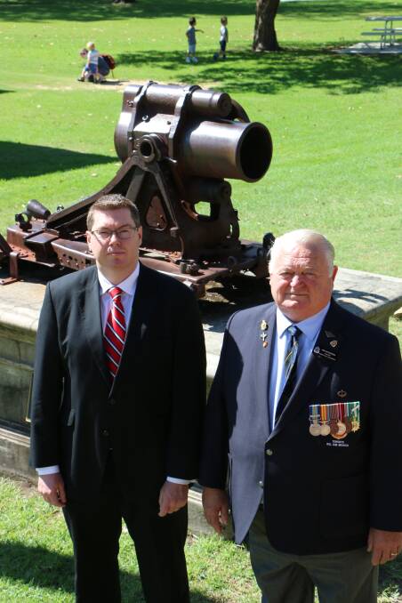 REMEMBERED: MP Pat Conroy and Toronto RSL Sub-branch president Ron Mitcherson at Speers Point Park ahead of Sunday’s Anzac event. They are pictured with the remains of a German gun, believed to be a Minenwerfer from World War I. Picture: David Stewart