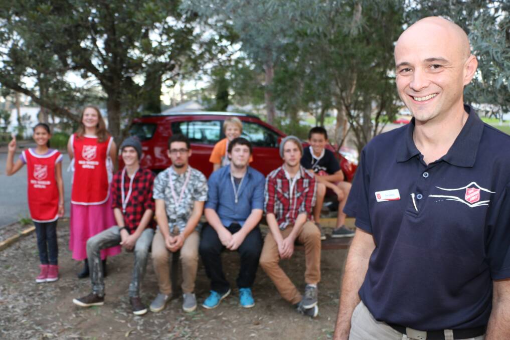 HELPING HAND: Tim Gittins and young volunteers are gearing up for the Salvation Army's doorknock appeal. Picture: Jamieson Murphy