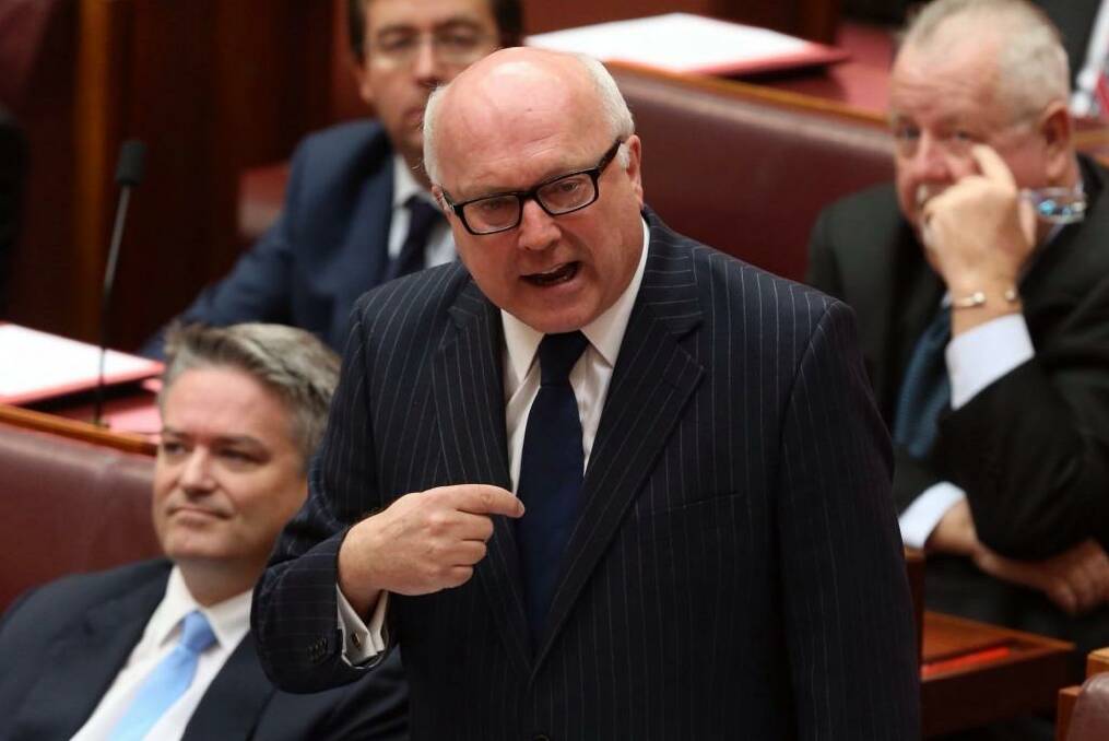 State and territory Attorneys-General have written to Senator George Brandis over a funding crisis for legal assistance. Photo: Andrew Meares
