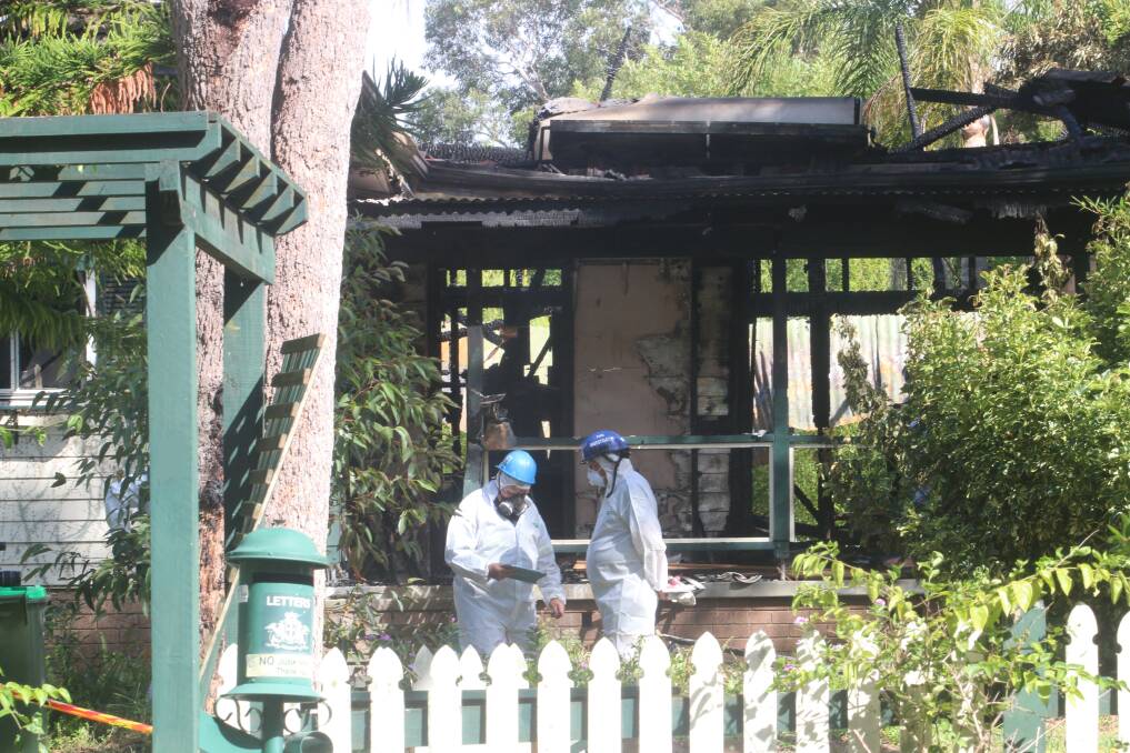 FATAL BLAZE: Fire investigation officers continue their work at the Bukkai Road home on Monday. Picture: Jamieson Murphy