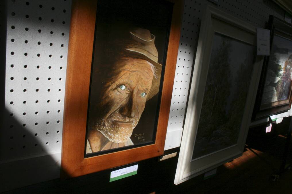 ART SHOW: Donald Balbi's self portrait, highlighted by a beam of sunlight at Rathmines Community Hall, at last year's festival. Picture: David Stewart