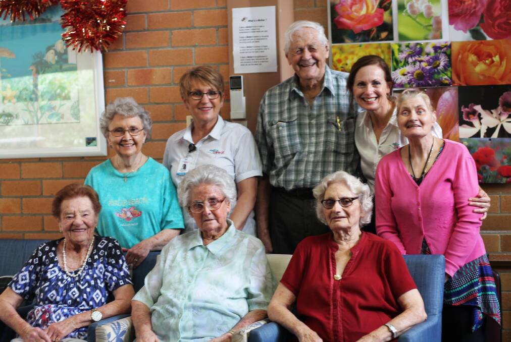 POSITIVE: Residential care manager Fiona McIntosh, standing left, with marketing and support manager Kylie Jacques, and CA Brown residents at Booragul.