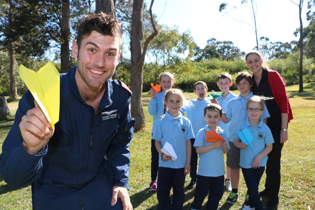 AERODYNAMICS: Paper plane exponent Dylan Parker shows Fassifern Public School students the science behind flight. Picture: Jamieson Murphy