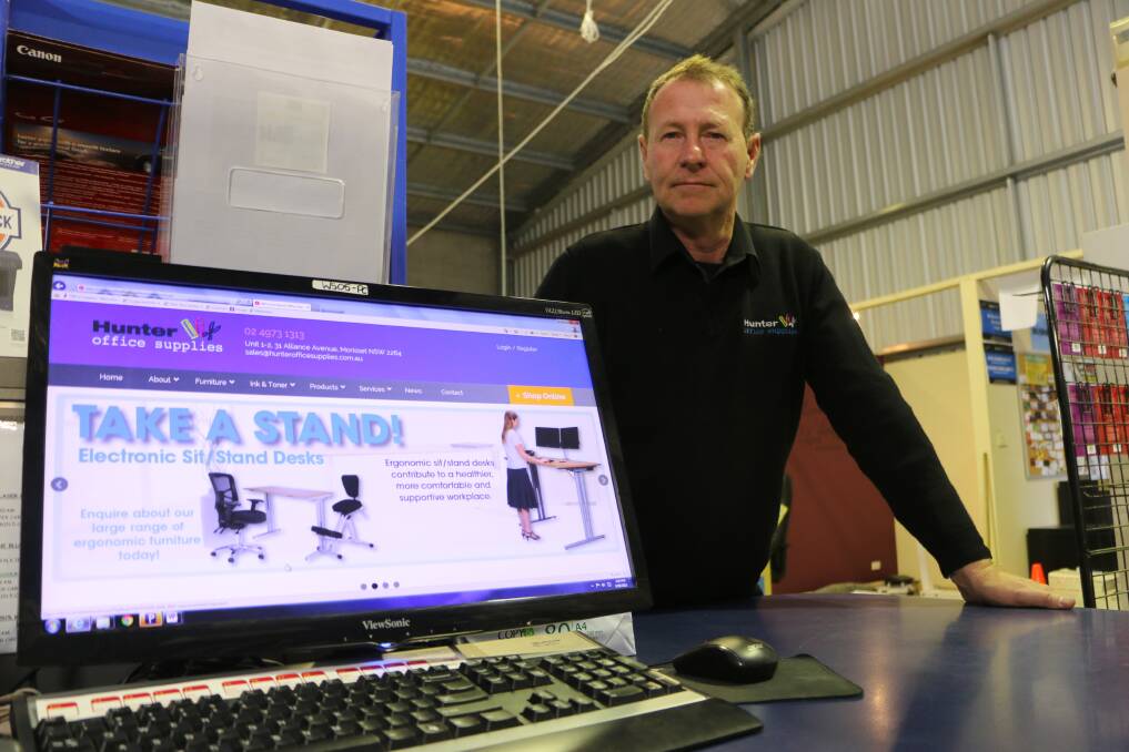 TOO SLOW: David Griffin of Hunter Office Supplies at Morisset says the slow internet is effecting his business. Picture: David Stewart
